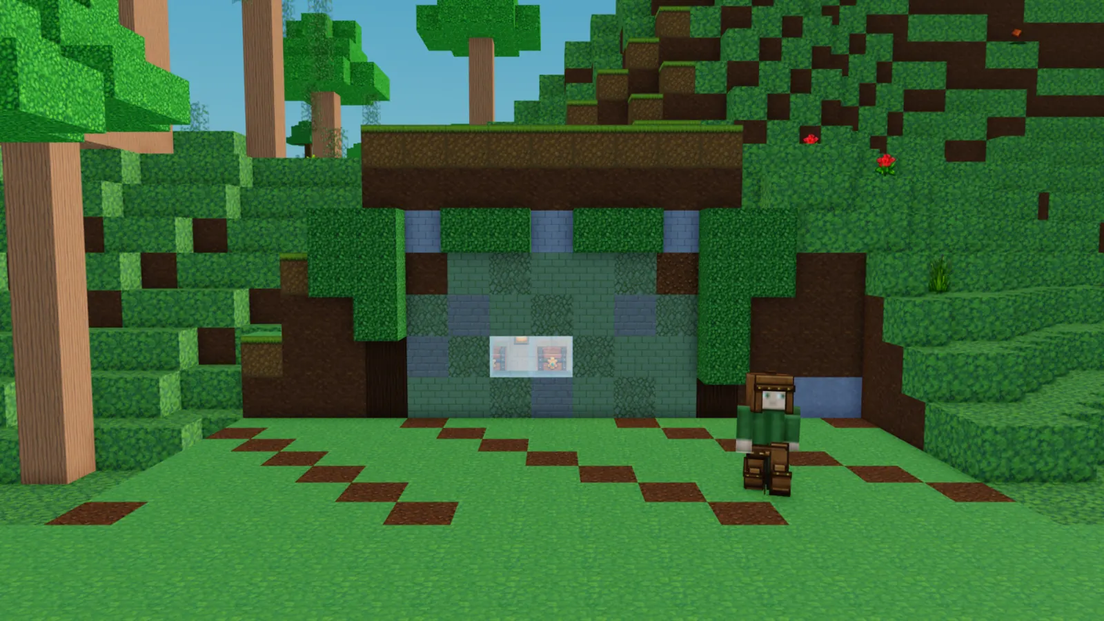 A base dug into a grassy hillside, its stone front half hidden under the trees.